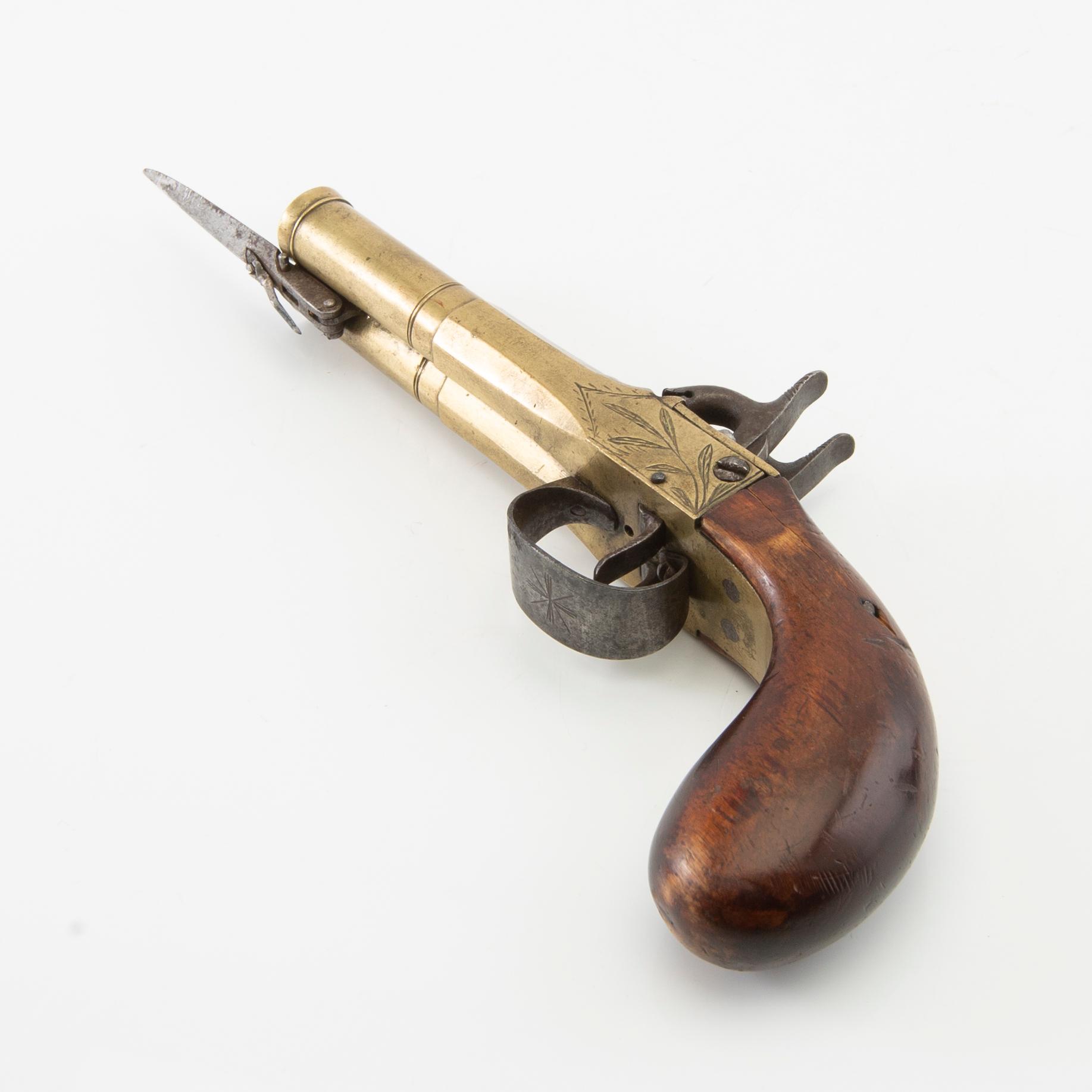 Double-barrel percussion pistol with bayonet, 19th century.
