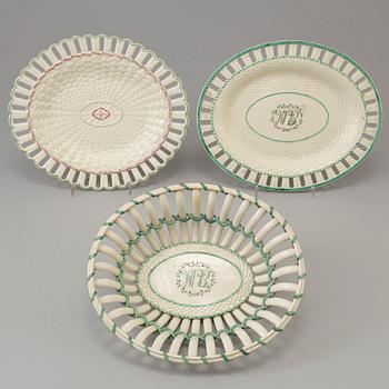 A CREAMWARE BASKET, PLATE AND A SIMILAR PLATE, one marked Wedgwood, first half of the 19th century.