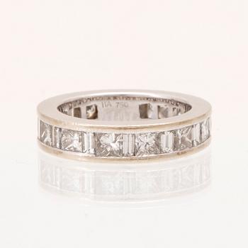 An 18K white gold eternity ring set with baguette and princess cut diamonds by Hartmann's Denmark.