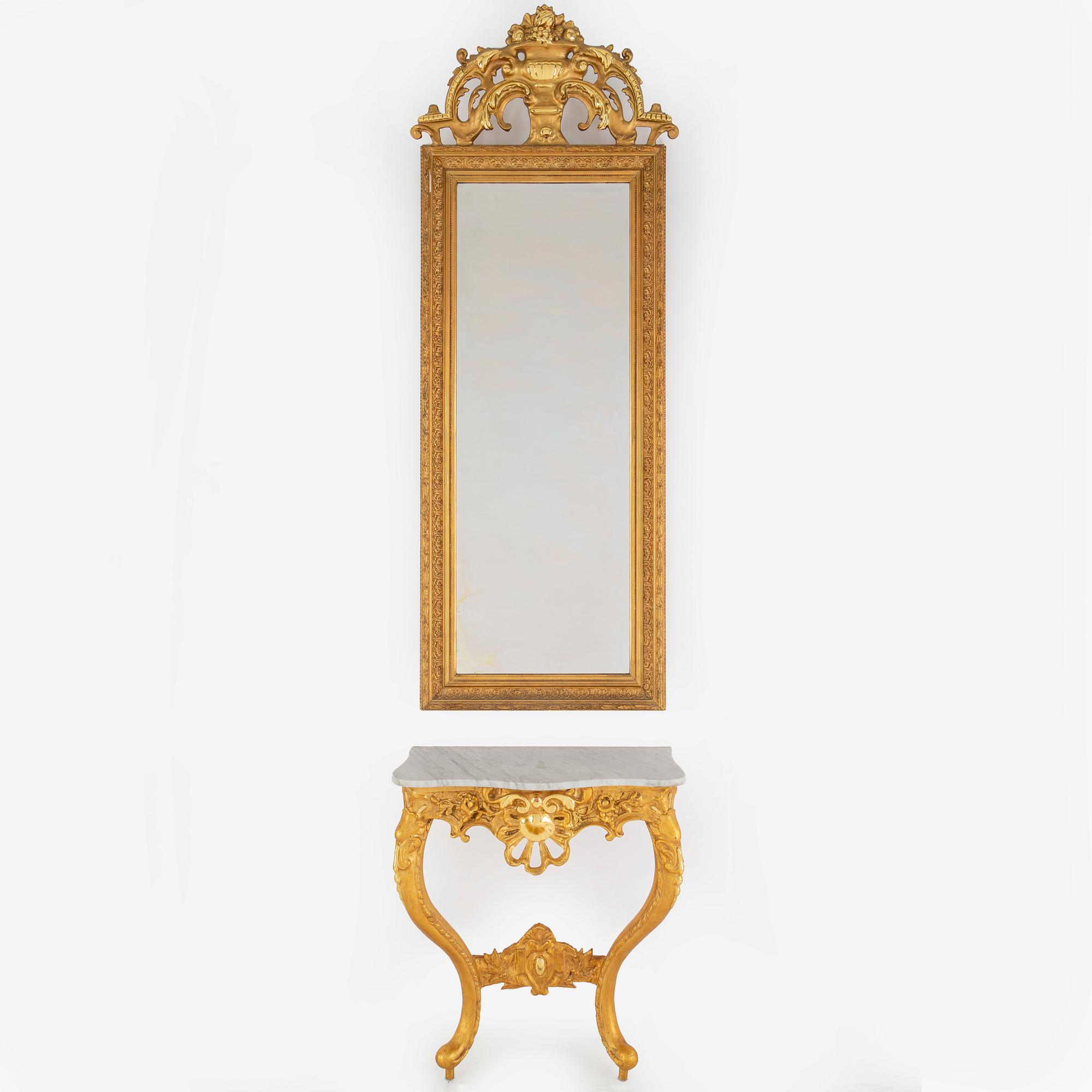 A second half of the 20th Century rococo style mirror with a console table.