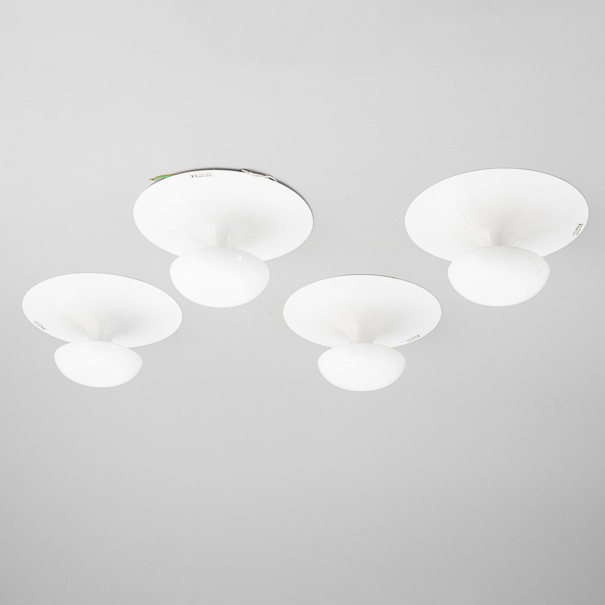 A set of four wall lamps from Vibia, Spain, 21st Century.