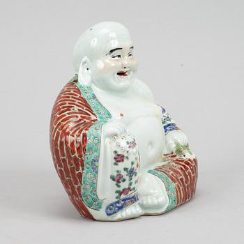 A seated famille rose decorated porcelain buddha, 20th century.