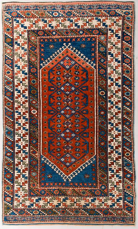 An oriental carpet. Circa 192x115 cm.