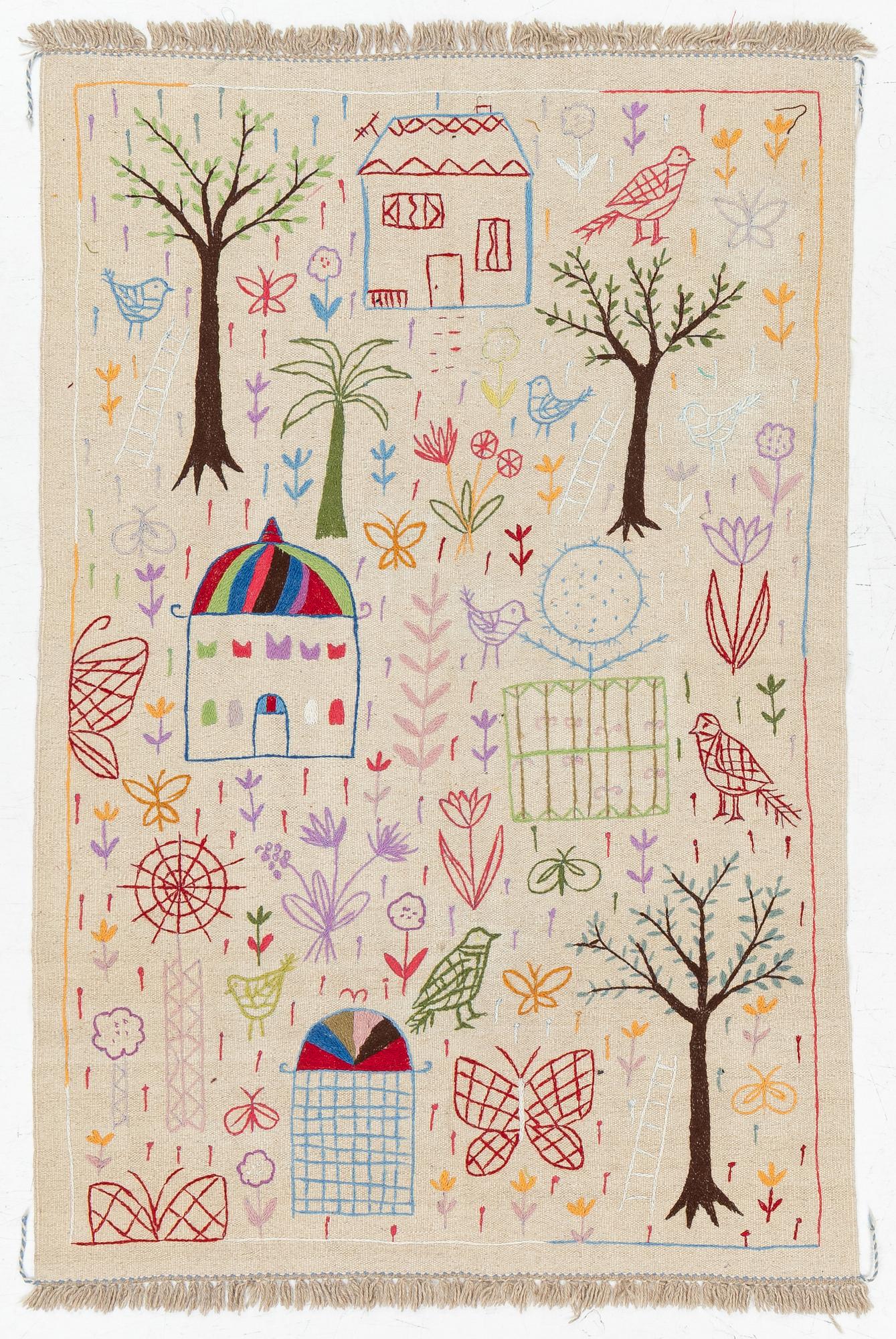 A hand-embroidered Kelim rug, 186 x 123 cm.