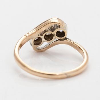 A 14K gold ring with old-cut diamonds.