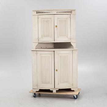 A Gustavian corner cabinet, 19th century.