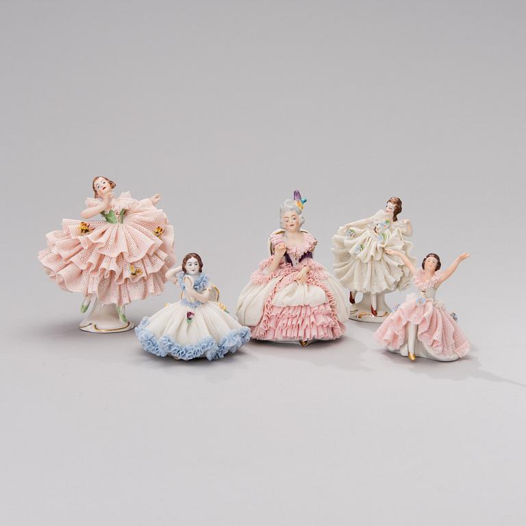 A set of five Dresden porcelain figurines in lace dresses. Mid-20th century.