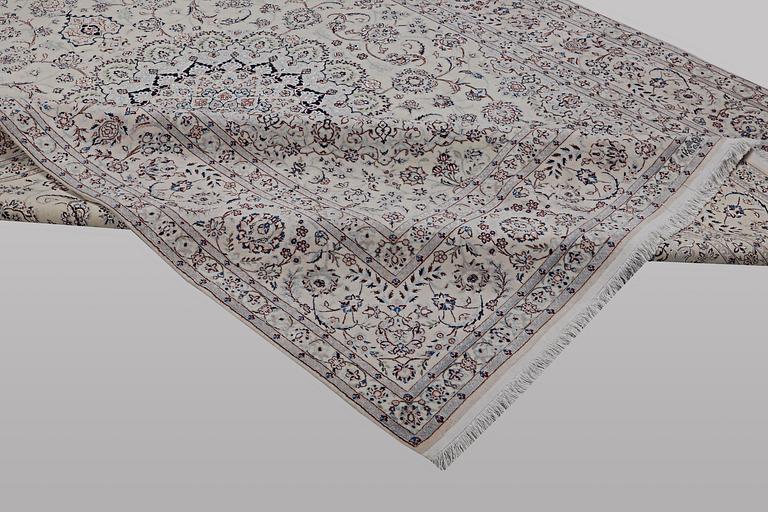 A carpet, Nain, part silk, ca 341 x 245 cm.