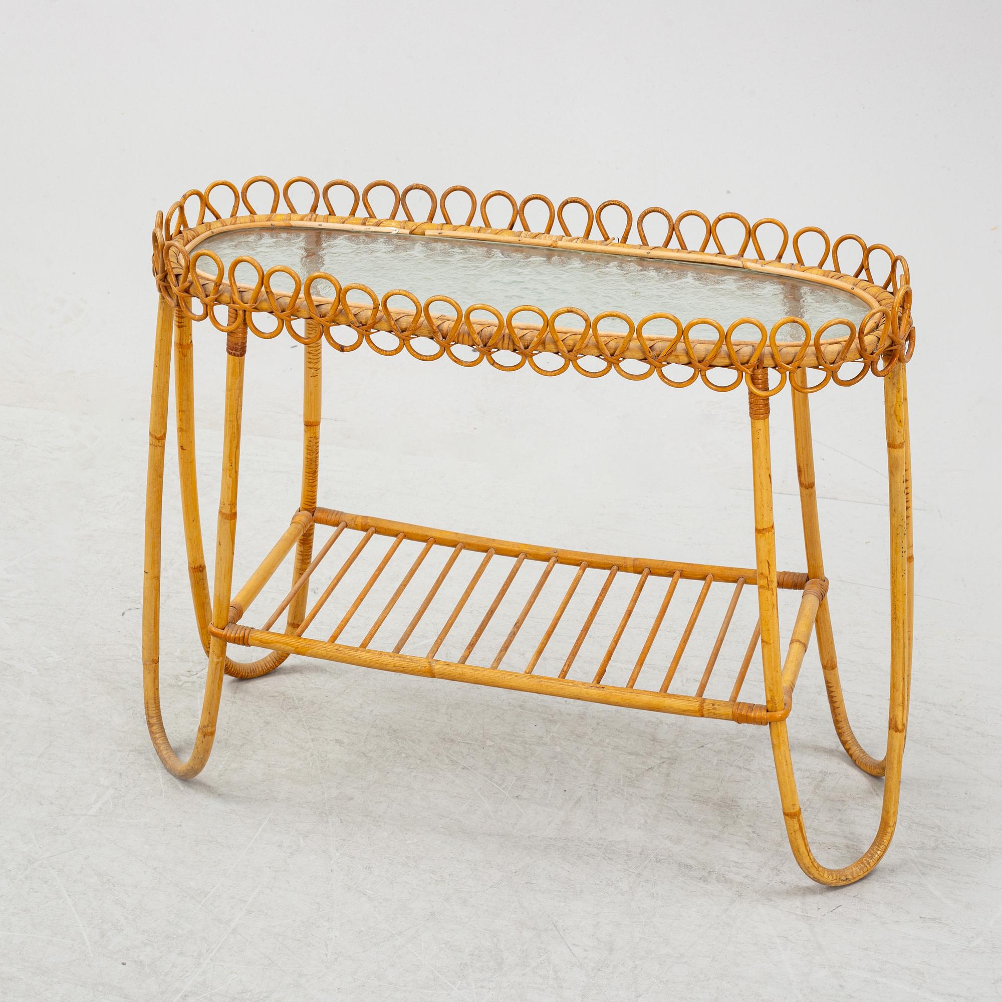 A rattan and glass flower table.