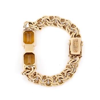 ARMBAND, 18K guld med fasettslipade citriner, NSE, Köping, 1970. Vikt 26,0 gram.