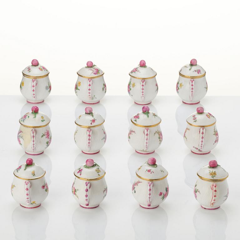 A set of 12 Swedish Marieberg soft paste custard cups with covers, 18th century.