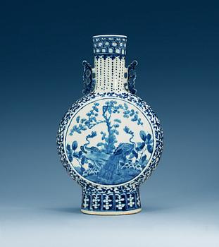 1609. A large blue and white moon flask, Qing dynasty, 19th Century.