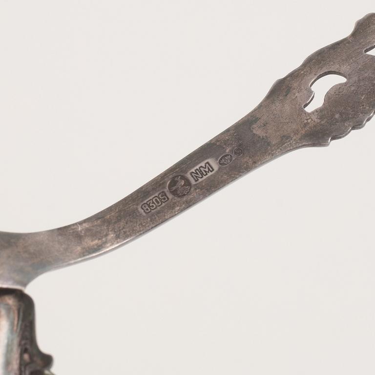 A 37-piece set of dessert cutlery, mostly the same model, with Swedish import marks.