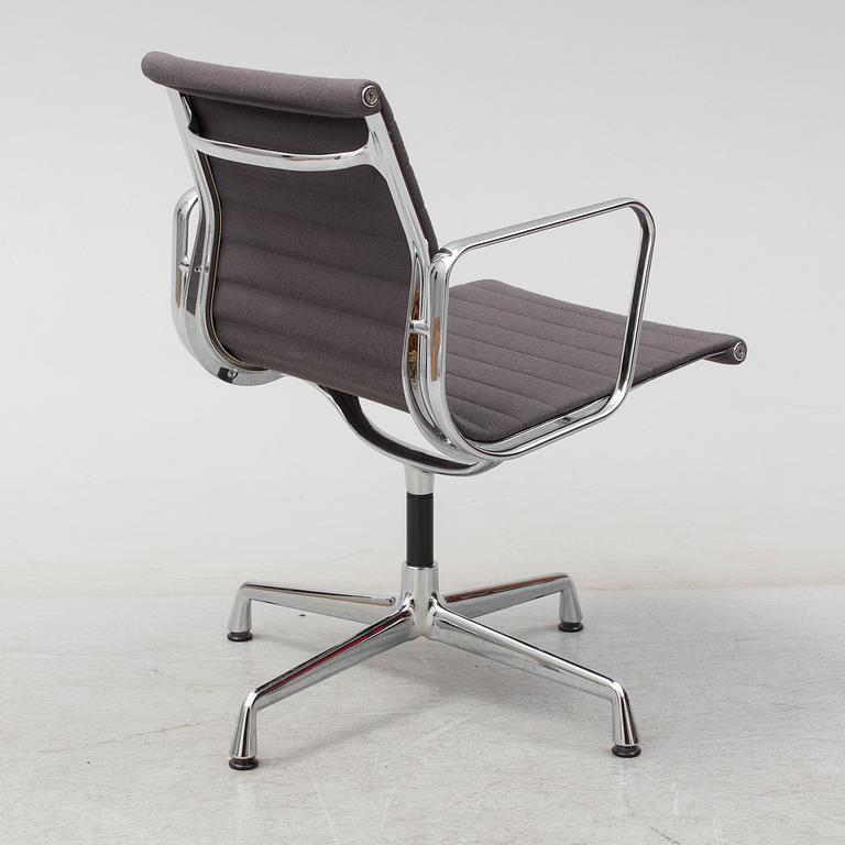 An 'EA 104 Swivel' armchair by Charles & Ray Eames, Vitra, 2007.