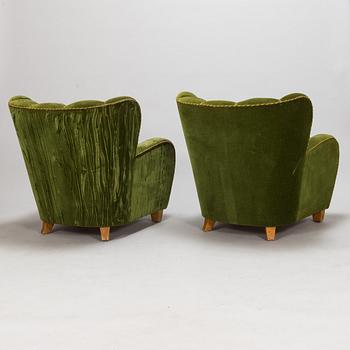 A pair of 1950s armchairs.