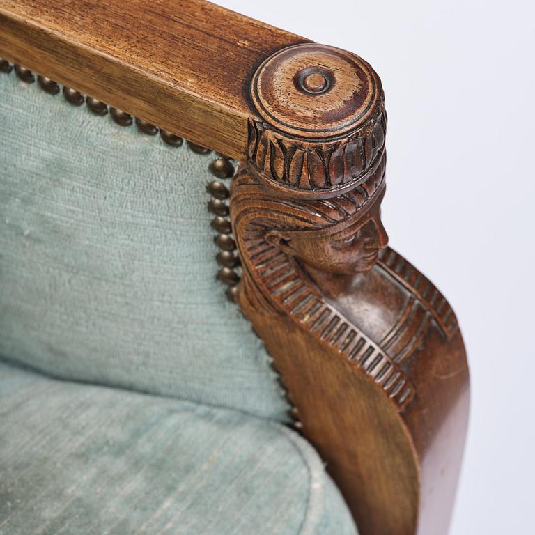 A pair of French Empire mahogny armchairs.