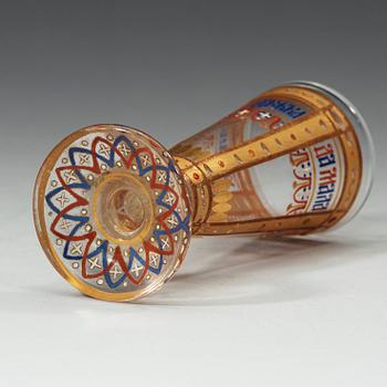 A small Russian vodka glass painted with enamel colours and gold, late 19th Century.