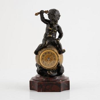 A bronze and marble figural timepiece, later part 18th century.