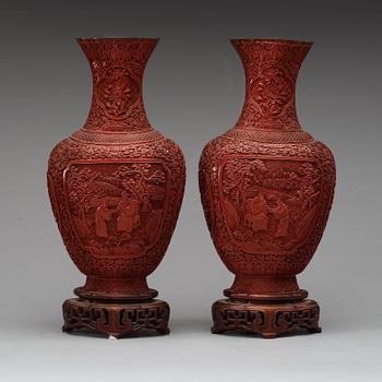 A pair of red lacquer vases, late Qing dynasty.