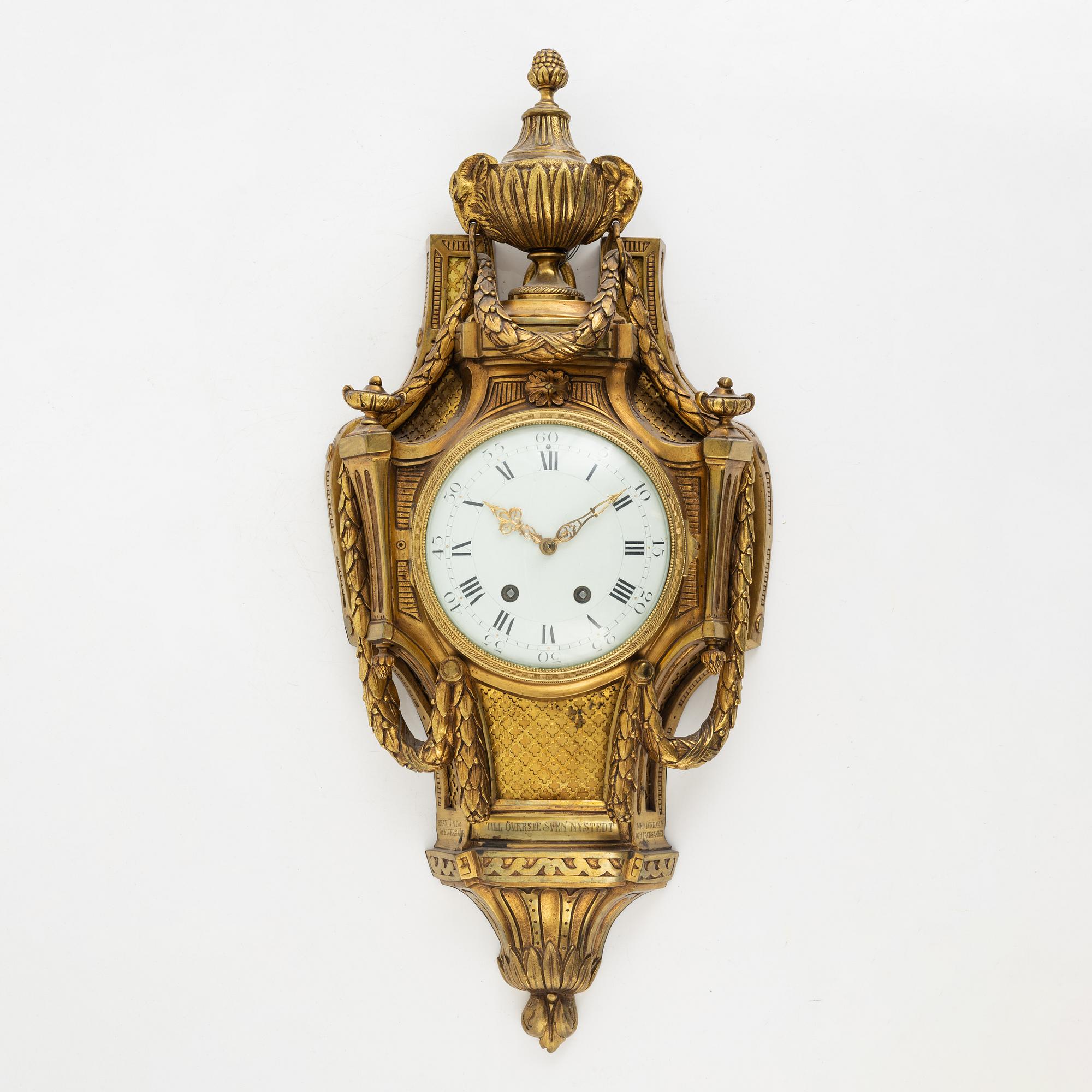 A Louis XVI-style wall clock, early 20th century.