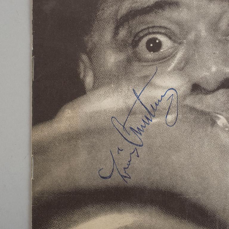 Autographs of Louis Armstrong with band.