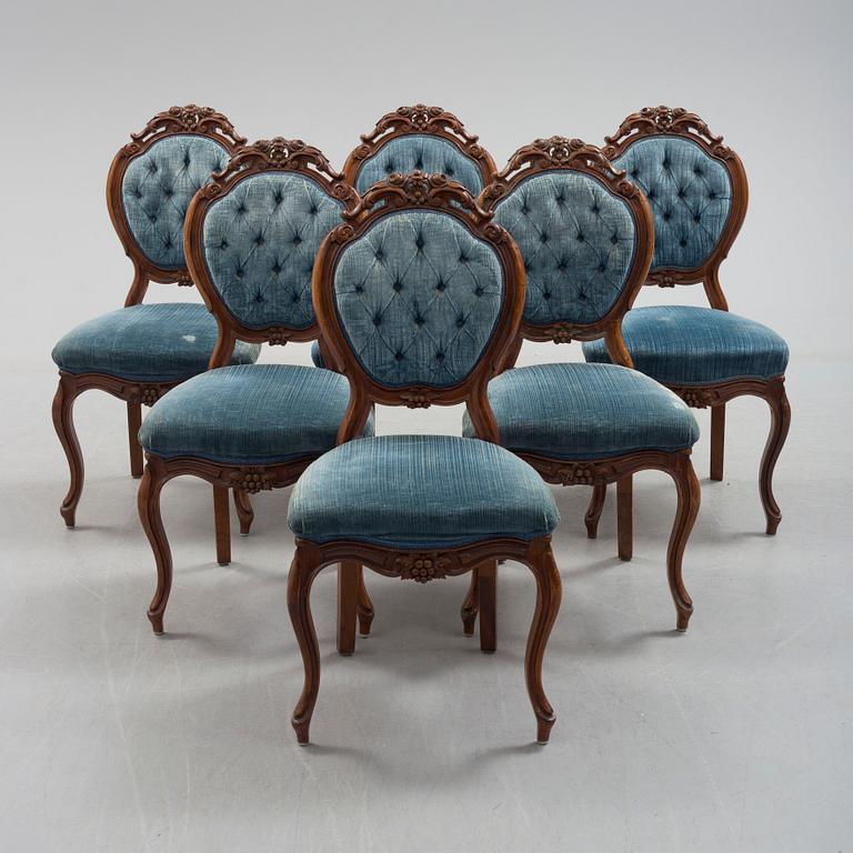 Six late 19th century walnut chairs.