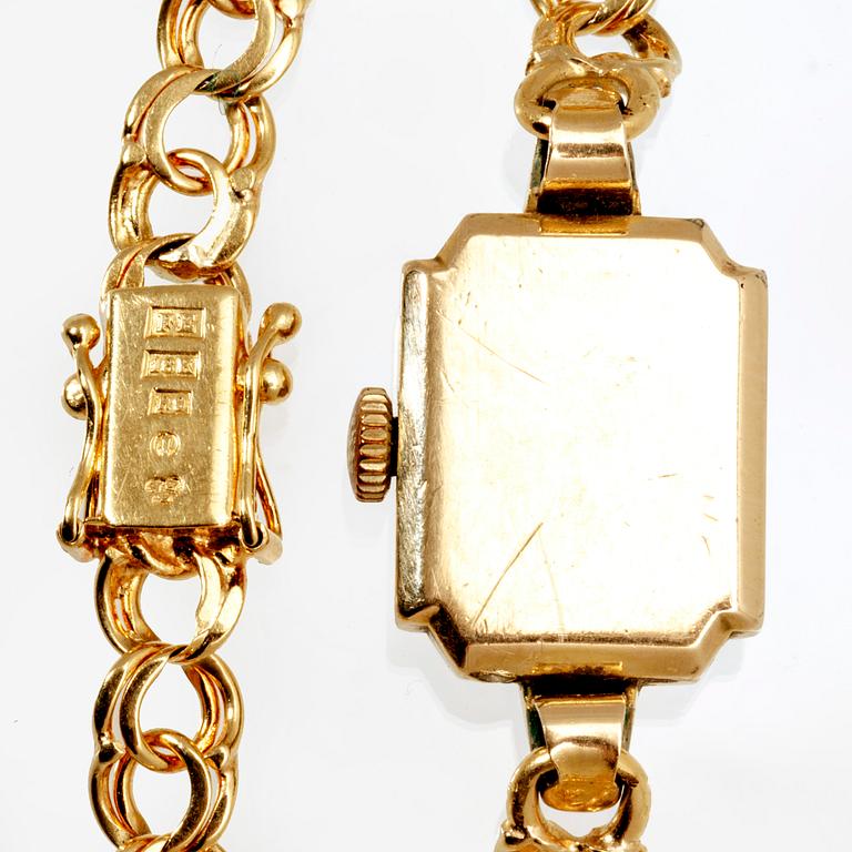 An 18 K gold wrist watch, Omega. Toral weight incl the watch 16 grams.