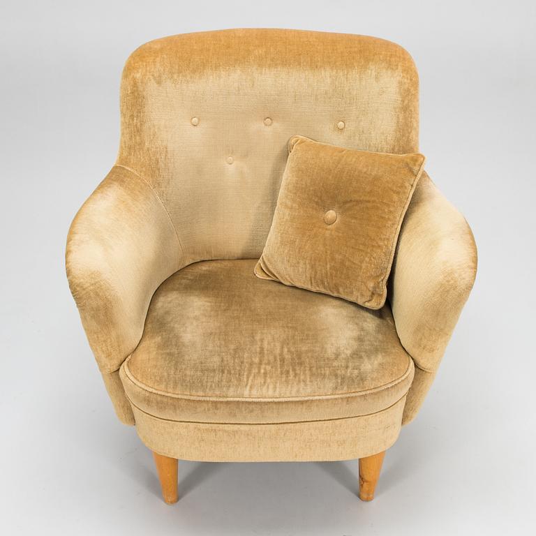 A mid-20th-century sofa and armchair.