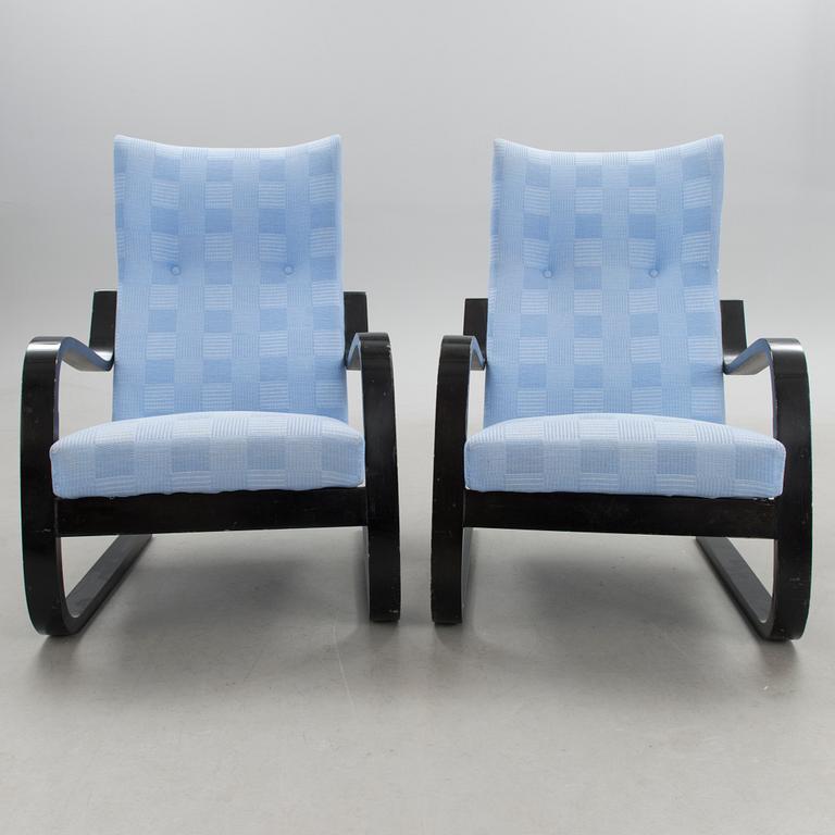 A pair of mid 20th century '36/401' armchairs for Artek, Finland.