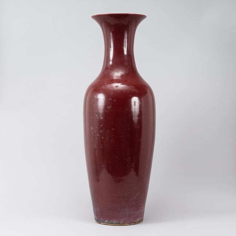 A massive red Chinese porcelain floor vase, modern production.