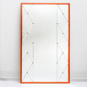 A 1960s teak mirror.
