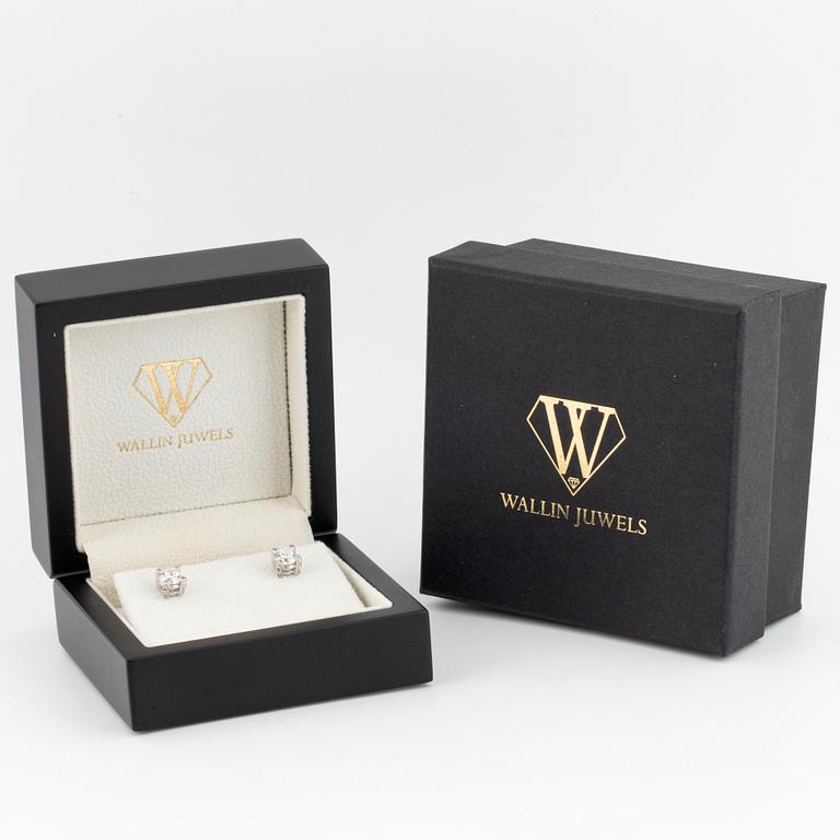 Brilliant-cut diamond stud earrings.