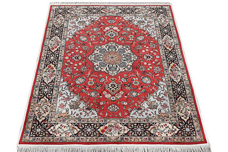 A carpet, Tabriz, part silk, c. 202 x 152 cm.