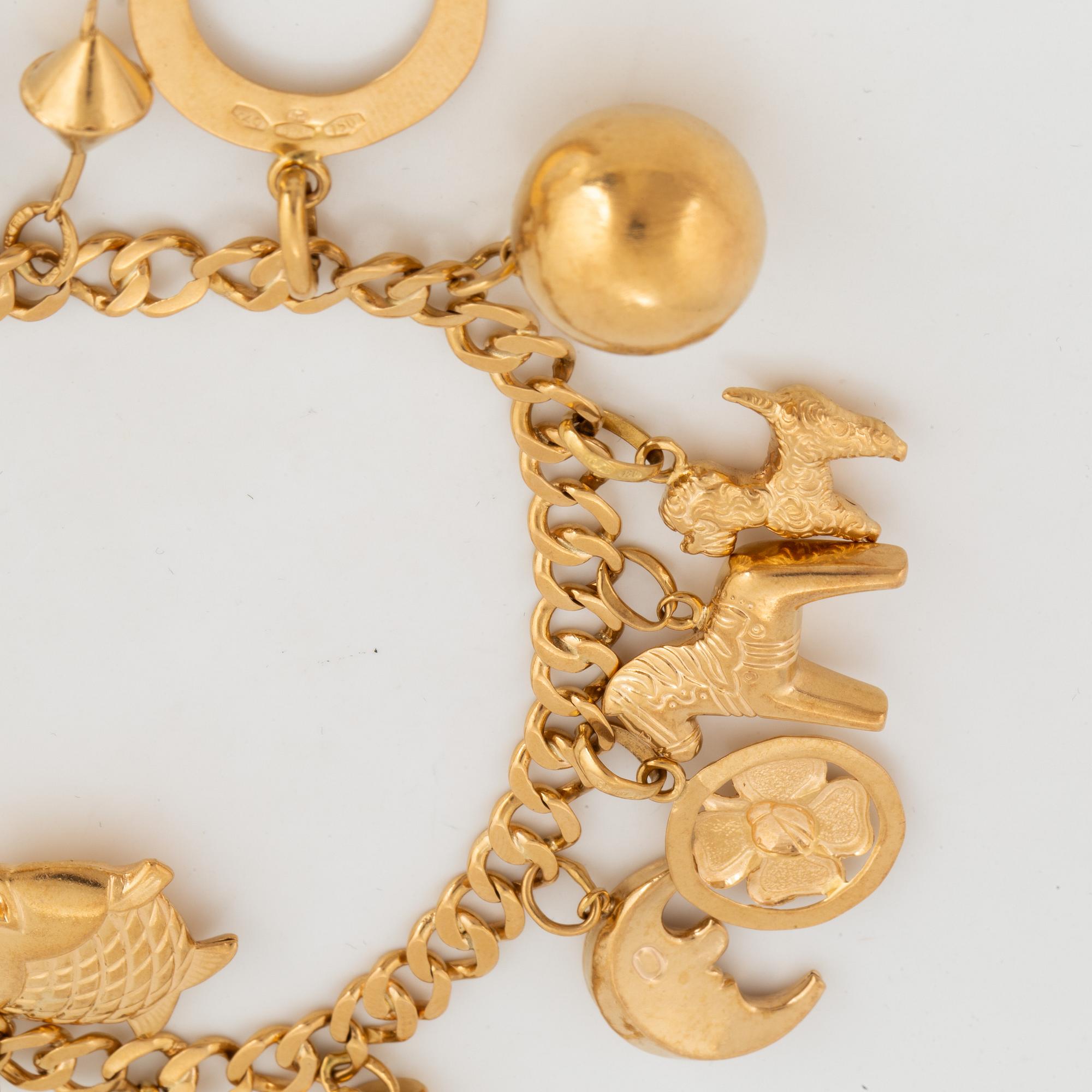 18K gold charm bracelet.