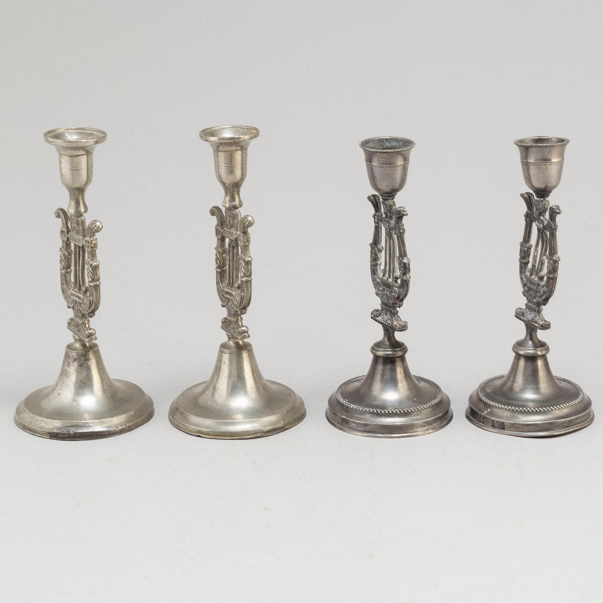 Two pair of Swedish pewter candlesticks, early 19th century and ca 1900.