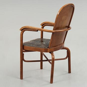 Sigurd Lewerentz, a stained beech and black leather armchair, Gemla, Sweden circa 1932.