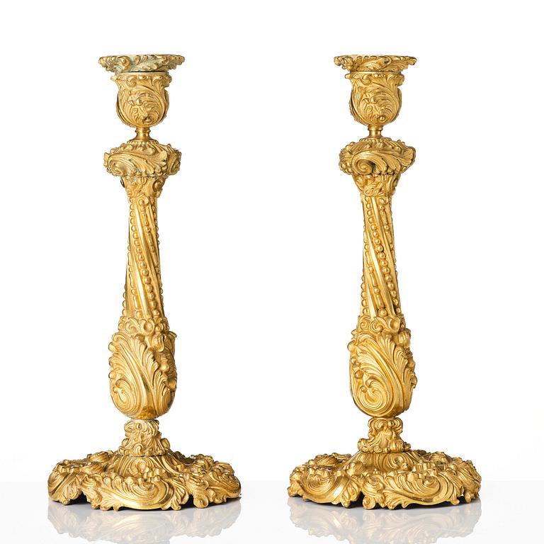 A pair of gilt-bronze rococo-revival candlesticks, later part 19th century.