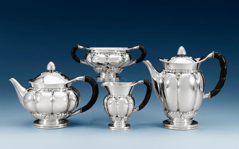A GEORG JENSEN set of 4 pcs of tea and coffee service, Copenhagen 1919-32, 830/1000 silver (coffee pot) and sterling, ebony handles, design nr 159.
