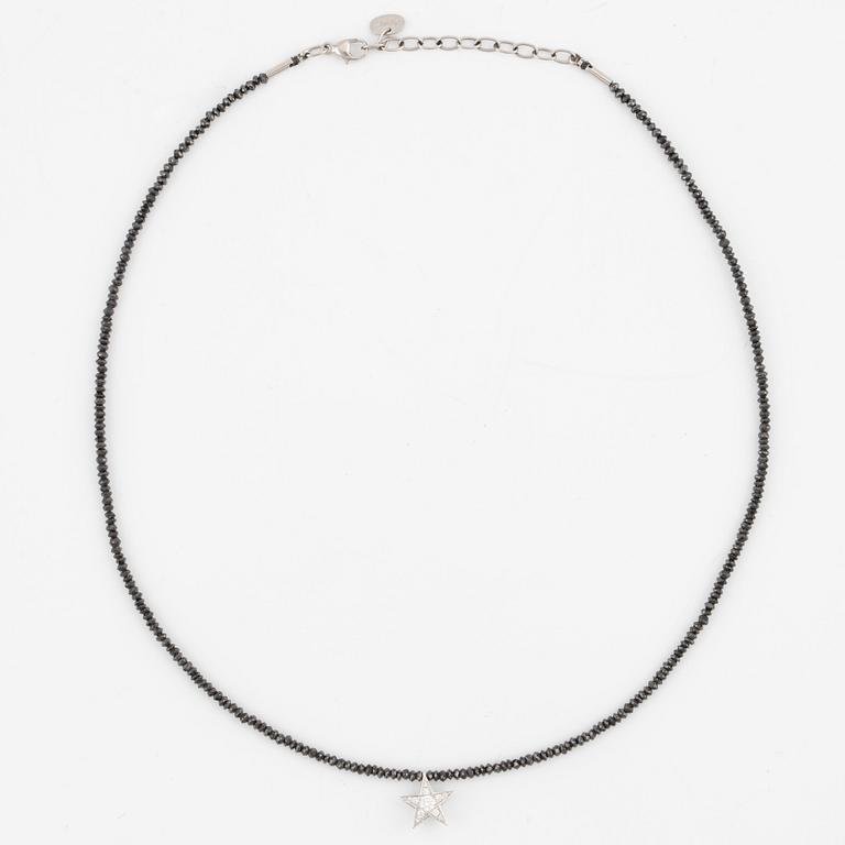 Necklace, Atelier Ajour, black diamonds with a star pendant set with brilliant-cut diamonds.