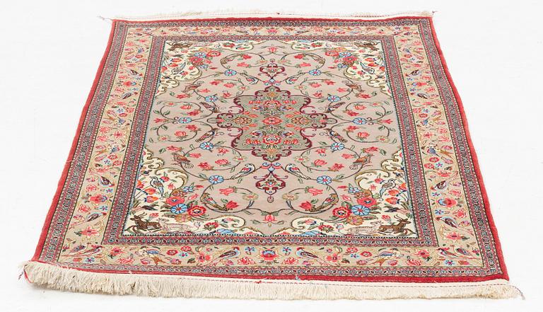 A Ghom rug, c. 160 x 105 cm.