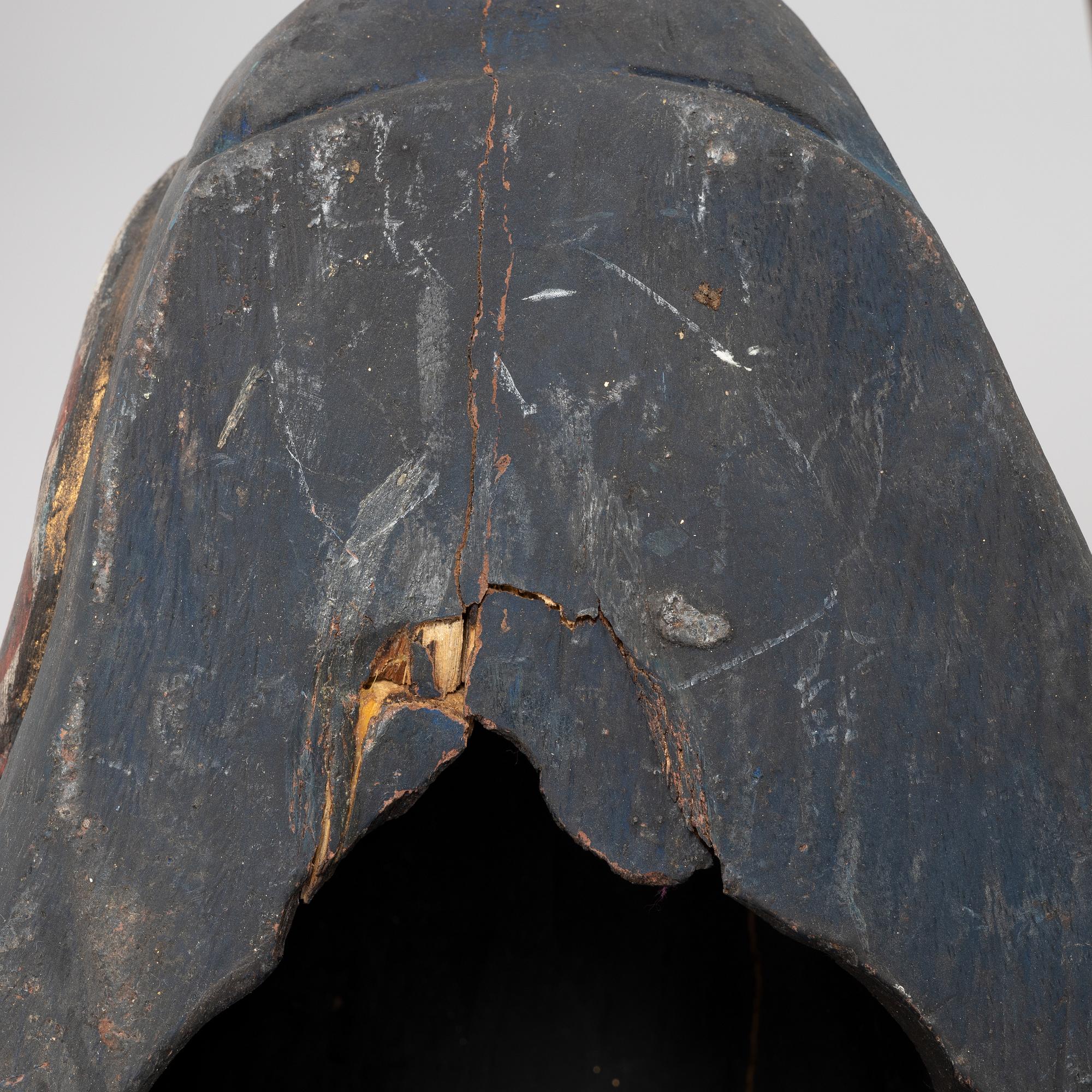 Four Tibetan/South East Asian wooden decorations, 20th century.