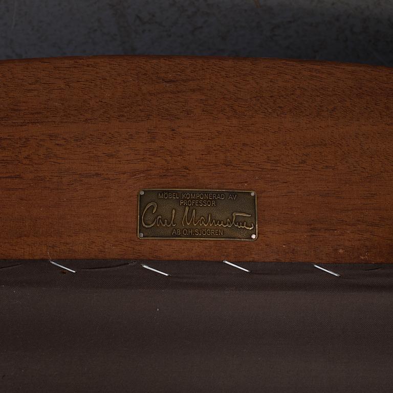 An "Vår Fru" armchair by Carl Malmsten.