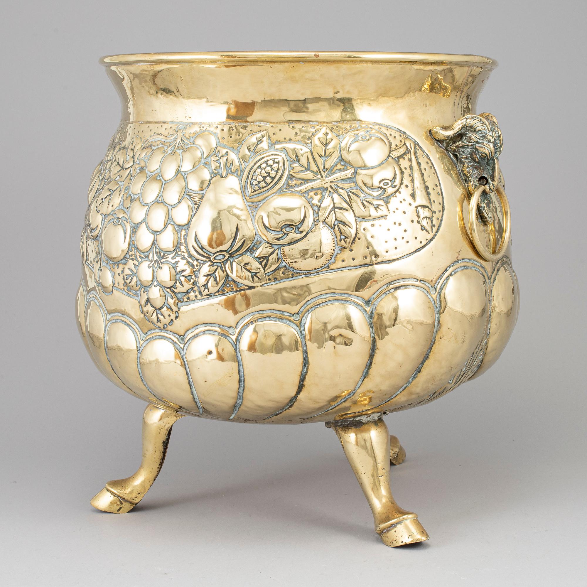 A 19th century brass champagne cooler.