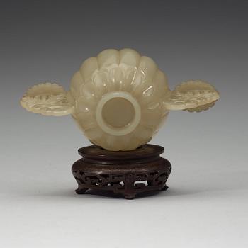 A nephrite cup with wooden cover and stand with silver inlay and quartz finial, Qing dynasty, 19th Century.