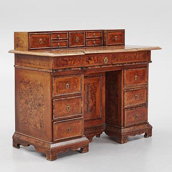 A Swedish late Baroque alder-veneered 'knee-hole' writing desk, first part of the 18th century.