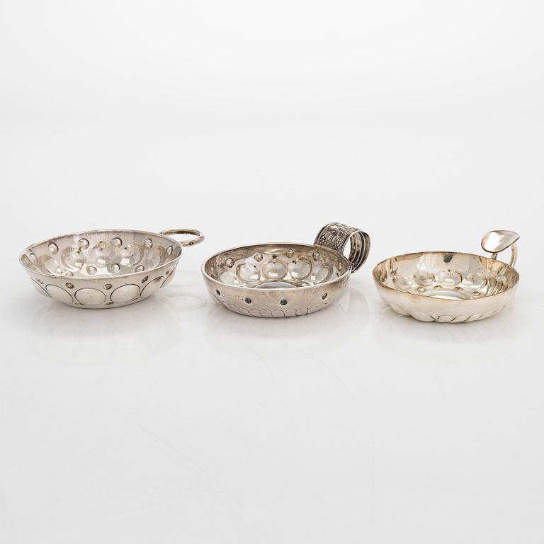 Two French .950 silver tastevin cups, and one silver plated. Latter half of the 19th century, and poss. early 20th.