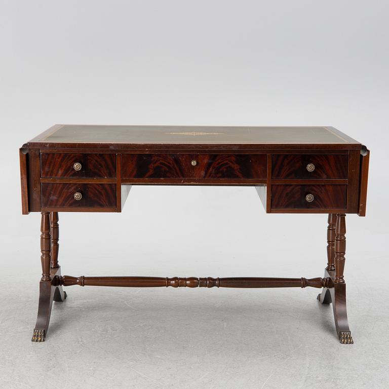 A mahogany veneer desk with desk chair, 20th Century.