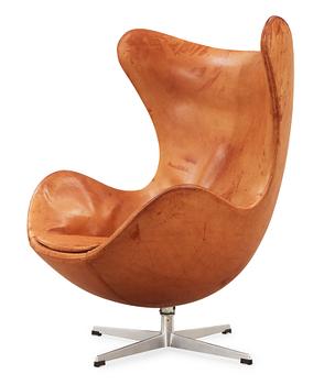 53. An Arne Jacobsen brown leather 'Egg Chair', Fritz Hansen, Denmark 1963.