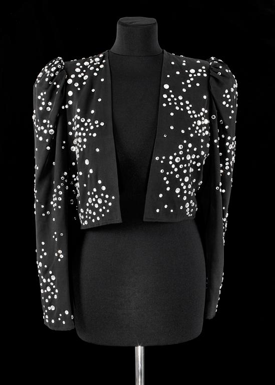 A black bolero by Yves Saint Laurent.