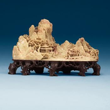 1416. A Chinese soapstone sculpture of a landscape, 20th Century.